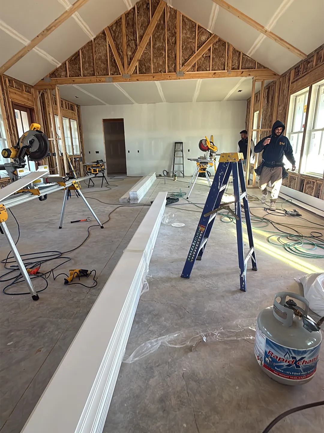 Organized residential renovation site after selective demolition and during framing work